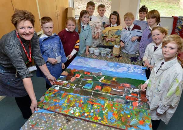 Artist, Jane Vaux and year 5 and 6 pupils at Brill C of E School with their artwork that will be shown at Art on the Hill. PNL-160403-122227009