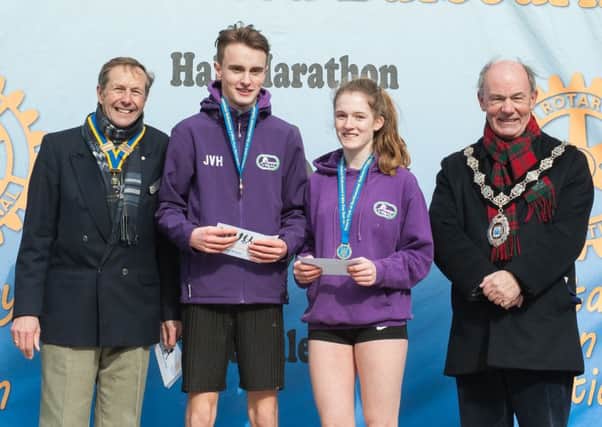 Grace Birdseye and Joshua van Heiningen with their awards for finishing as first Juniors (U16) in the Berkhamsted Five Mile Fun Run. Picture (c) Vanessa Champion