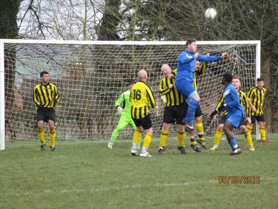 Chris Cackett scored within four seconds four Aylesbury Dynamos Reserves (blue)