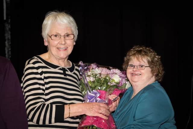 Presentation to Pam Sheppeck who founded the Aylesbury Gateway Club in 1982 for adults with learning difficulties. She is retiring in November. pictured is Nicky Reid  - one of the original club members presenting a bouquet to Pam PNL-160703-213318009