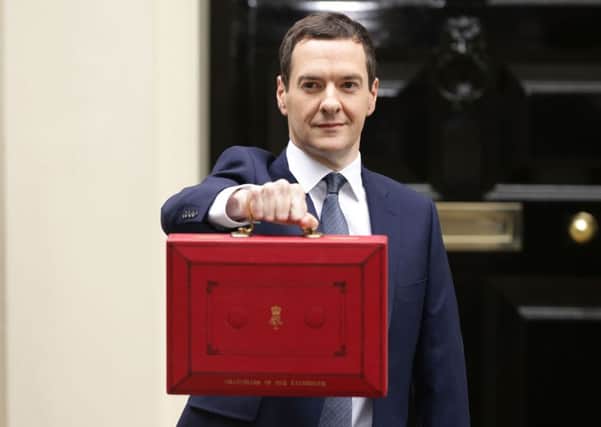 The Chancellor of the Exchequer George Osborne outside No 11 Downing Street, London, before delivering the Budget Statement in the House of Commons. PRESS ASSOCIATION Photo. Picture date: Wednesday July 8, 2015. Photo credit should read: Yui Mok/PA Wire