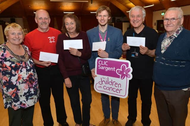 Cheque presentations to charities at Buckingham Community Centre. Cash raised by Sue and Tiddler Carter's Bingo Evenings. From the left, Sue Carter, Nick Mellors, British Heart Foundation, Barbara Davidson, Age Concern Buckingham and District, James McDonald, Clic Sargent, Rex Stevens, Prostate Cancer UK and Tiddler Carter. PNL-161003-214545009