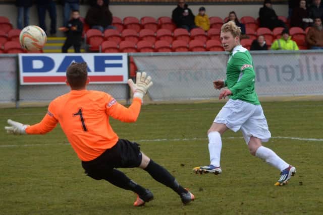 Shannon Jesson attempts to beat Arlesey goalkeeper Nick Thompson. Pictures by Jake McNulty