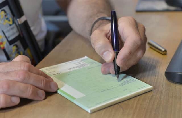 GP writing a prescription, as shortage worsens according to new survey. Photo: Anthony Devlin/PA Wire