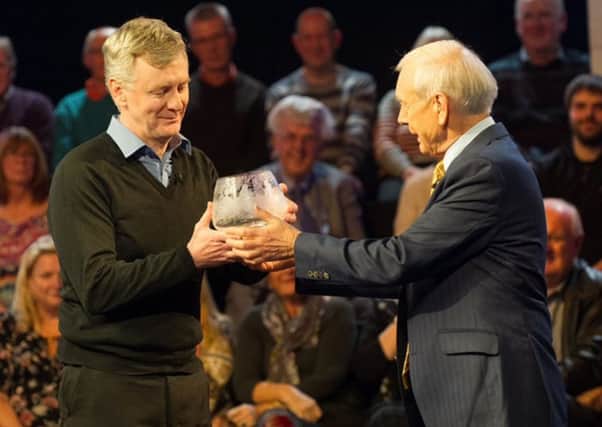 John Humphrys presents the Matermind trophy to Alan Heath