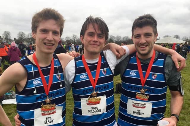 Oli (centre) with friends Ross Elsby and Jon Whitby, having completed the Hampton Court Palace half-marathon