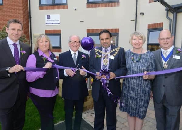 John Bly is joined by Aylesbury mayor Cllr Tuffail Hussain and other guests for the opening of Buckingham Lodge care home in April 2015