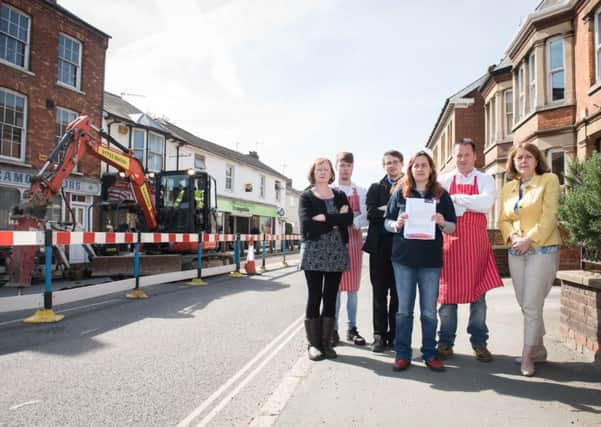 Winslow shop owners complaining about the roadworks on the High Street