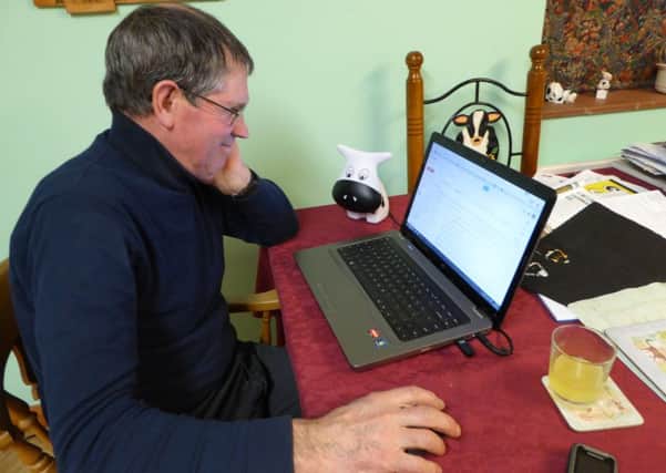 Farmer on his laptop