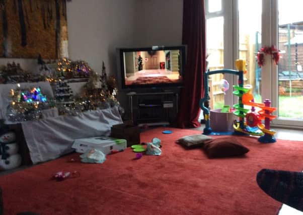 Pictured is the red rug in Natalie Hemming's living room, which police are searching for