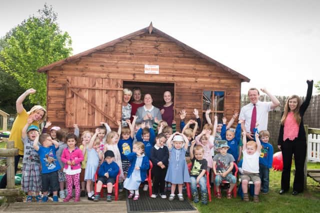 Grendon Underwood school's Muddy Boots nursery gets a new play house, donated by K & Z Sheds PNL-160517-113154009