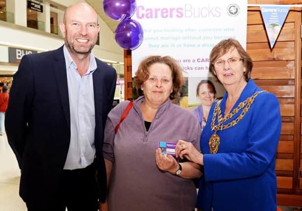 Carers Bucks chief executive Stephen Archibald (left), mayor of Aylesbury Barbara Russel (right) and one of the carers that signed up on the day