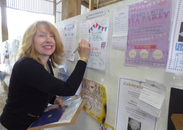 Heather Jan Brunt judging a poster competition at the Bucks YFC rally, Waddesdon Country Show 2016