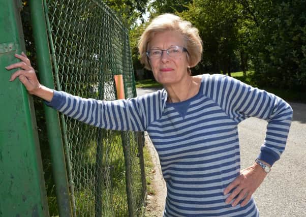 Cllr. Jackie Phipps at the gates of the Calvert landfill site in Brackley Lane. PNL-140820-130401009