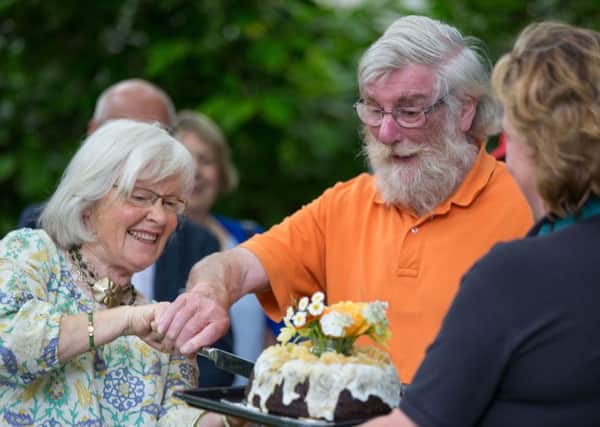 Margaret and Peter Aldington cut 50th anniversary cake at Turn End.