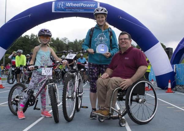 Shelley Cleave who completed the Tour de Vale won an Inspirational Endeavour award. Pictured left is her daughter Talia and right is WheelPower chief executive Martin McElhatton