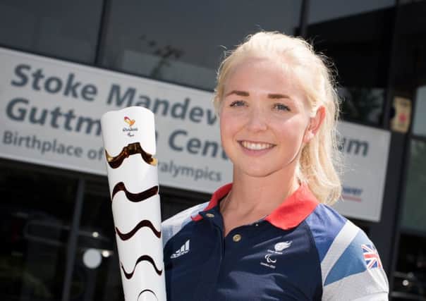 Pam Relph pictured with the Paralympic torch ahead of the Rio 2016 Games