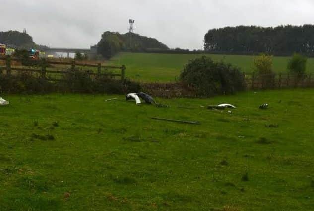 Debris from the car in a field after a serious accident just off the M40 motorway yesterday