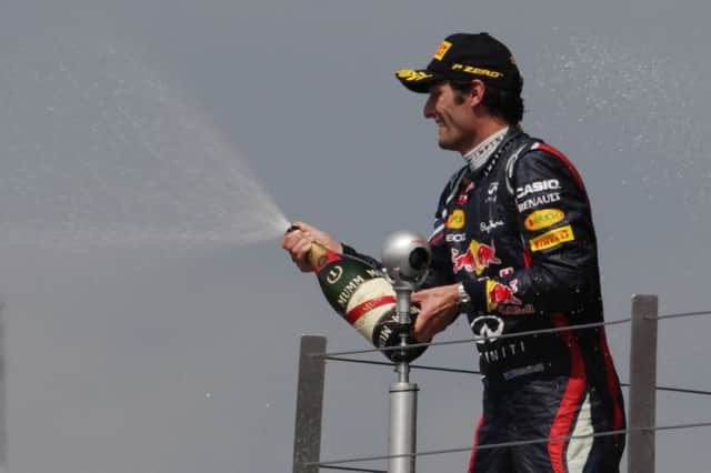 Mark Webber celebrating after winning the 2012 British Grand Prix