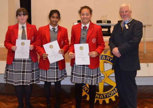 Rotary Club of Aylesbury Hundreds president Roger King with Thornton College students Mya Dowdall, Kaela Williams and Maya John, winners of the Youth Speaks competition