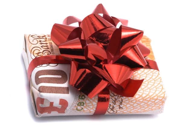 Gift money, birthday money gift-wrapped Â£10 note. iStock image