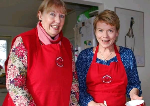 Kathryn Clamp (left) receives cookery tuition from Katie Ryder Richardson. Picture by Sonja Francis.