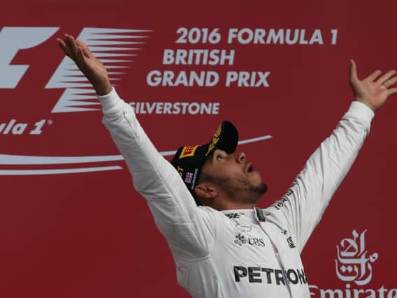 Louis Hamilton celebrates wining the British GP