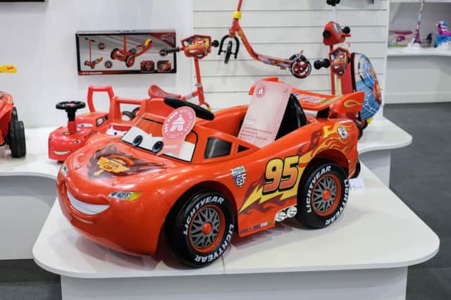 A ride-on replica of Cars' Lightning McQueen has been tipped as one of 2017's top toys - despite costing a whopping £200. The pricey battery-powered car - complete with 'Lightyear' printed wheels - has a maximum speed of just 3km/h. See National News story NNTOY; A ride-on replica of a Disney toy car has been tipped as one of 2017s top toys - despite costing a whopping £200. The pricey battery-powered Cars' Lightning McQueen vehicle - complete with 'Lightyear' printed wheels - has a maximum speed of just 3km/h. Other pricey picks included a wooden 'Forest Cottage', a 40,000 piece Disney Moments puzzle, and a controversial 'hover board' - all at a mind-boggling £400. The toys were on display as part of Britain's biggest toy show, Toy Fair, taking place at Olympia Exhibition Centre in Kensington, west London.