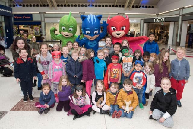 Children at Friars Square Shopping Centre with characters from TV show PJ Masks