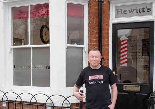 Jack Ewing outside the new Hewitt's barbers shop in Waddesdon. Picture by Michelle Tebbutt.