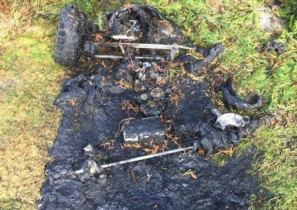 The remains of a child's toy car after a fire in Monks Risborough