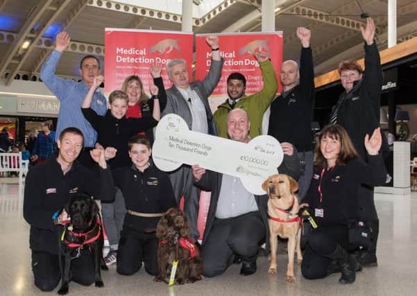 Friars Square Shopping Centre donate money raised from their Christmas grotto to Medical Detection Dogs