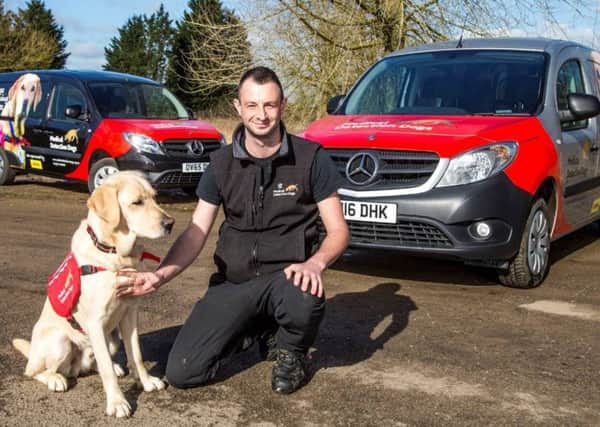 Bio-detection dog Axel and trainer Mark Doggett, with Medical Detection Dogs new Mercedes-Benz Citans