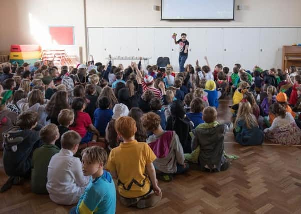 Author Steve Cole leads a whole school assembly at Haddenham Community Junior School as part of World Book Day. All pictures courtesy of haddenham.net.