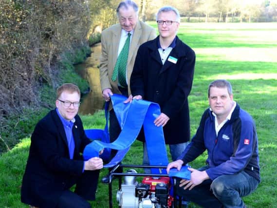 Warren Whyte, Billy Stanier, Mike Smith and Gary Wade with an emergency flood pump at The Willows