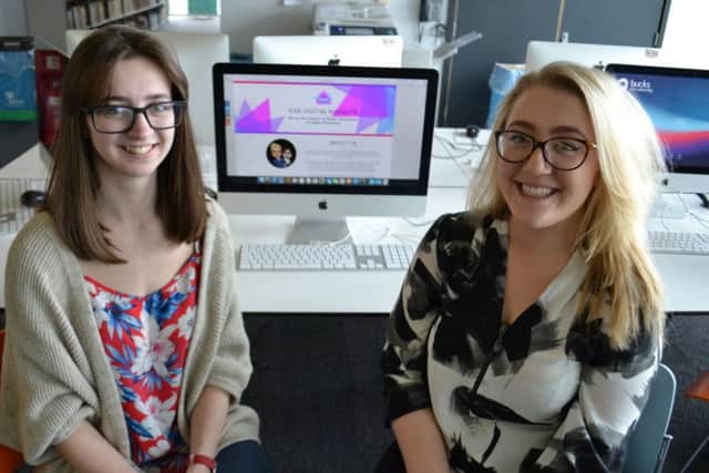 Sarah and Katie pictured either side of the homepage for the website of their company KAS Digital Insights