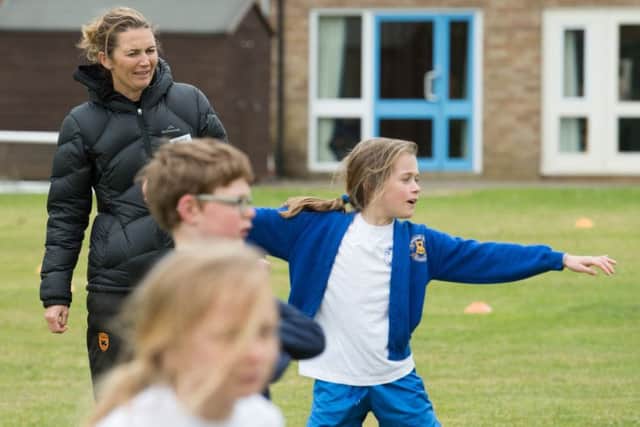 Former England womens cricket captain Charlotte Edwards coaches children at St Michaels School in Stewkley