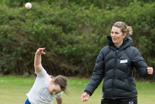Former England womens cricket captain Charlotte Edwards coaches children at St Michaels School in Stewkley