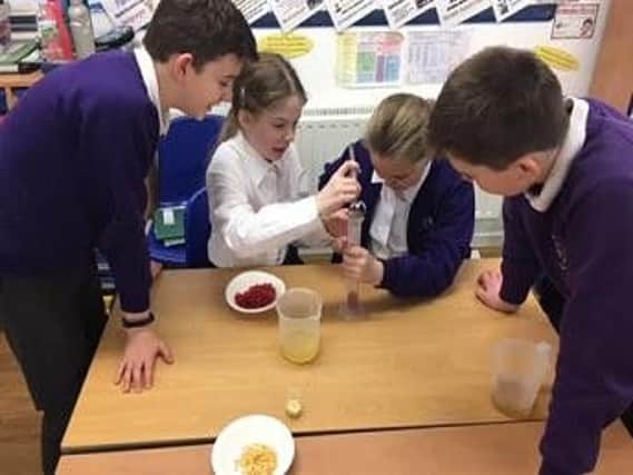 Year 6 pupils at Swanbourne CE School making their own blood in Science