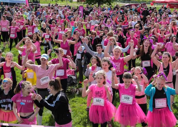 Runners warm up ahead of the 2017 Race for Life at Waddesdon Manor