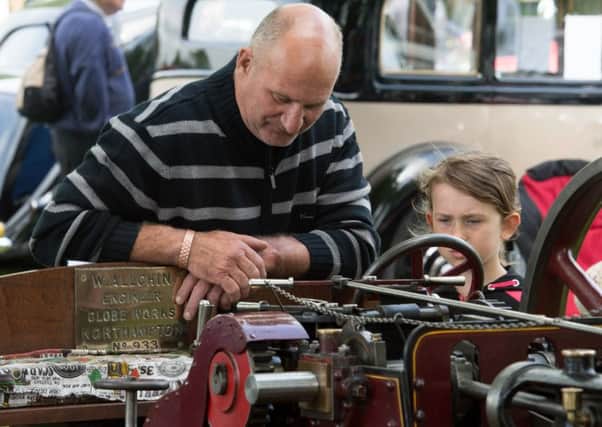Stewkley Country Fayre - Michael and Lauren Stanbridge look at a traction engine