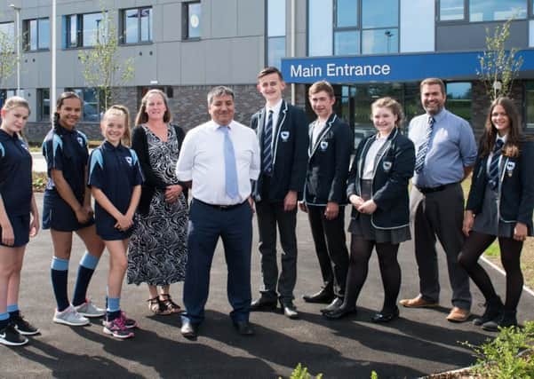 The newly opened Sir Thomas Fremantle School, a free school in Winslow - pictured with pupils and staff is head Darren Lyon