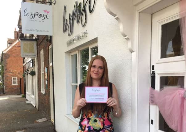 Kerry Hogg is all smiles as she visits Le Sposi on Wendover High Street to collect her prize