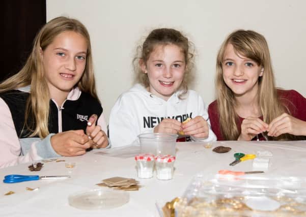 Haddenham Miniatures Show at the village hall - pictured are Lily Nessbach (11), Tegan Lumsden(12) and Hollie Owen (13)