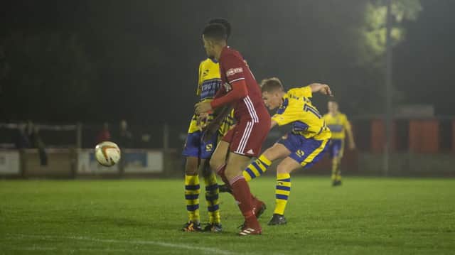 Harry Scott brilliantly finds the top corner for one of his two goals in Monday's game at Beaconsfield. Pictures: Marc Keinch