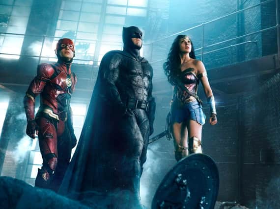Ezra Miller as Flash, Ben Affleck as Batman and Gal Gadot as Wonder Woman